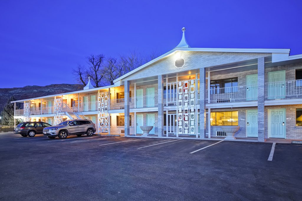 Expedition Lodge Moab retro-style hotel exterior with exterior doors, located near Arches National Park and downtown Moab.